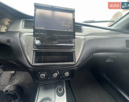 Чорний Міцубісі Lancer, об'ємом двигуна 1.6 л та пробігом 162 тис. км за 4650 $, фото 15 на Automoto.ua