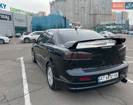 Черный Мицубиси Лансер, объемом двигателя 2 л и пробегом 246 тыс. км за 7500 $, фото 3 на Automoto.ua