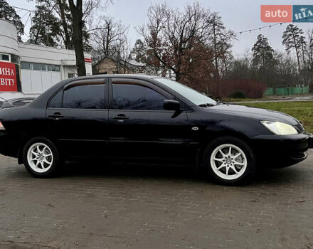 Чорний Міцубісі Lancer, об'ємом двигуна 1.6 л та пробігом 303 тис. км за 4350 $, фото 3 на Automoto.ua