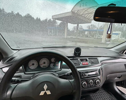 Черный Мицубиси Лансер, объемом двигателя 1.58 л и пробегом 254 тыс. км за 5000 $, фото 22 на Automoto.ua