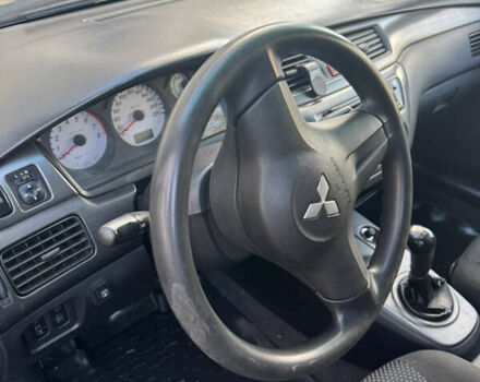 Чорний Міцубісі Lancer, об'ємом двигуна 1.58 л та пробігом 243 тис. км за 3800 $, фото 4 на Automoto.ua
