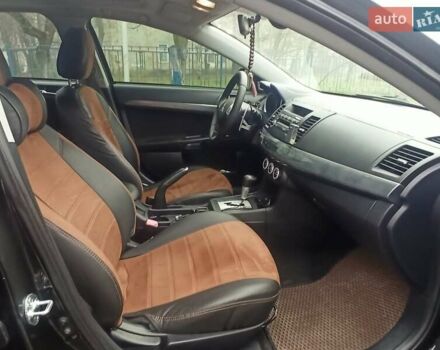 Черный Мицубиси Лансер, объемом двигателя 2 л и пробегом 195 тыс. км за 7899 $, фото 13 на Automoto.ua