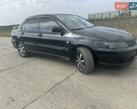 Чорний Міцубісі Lancer, об'ємом двигуна 1.6 л та пробігом 310 тис. км за 5100 $, фото 14 на Automoto.ua