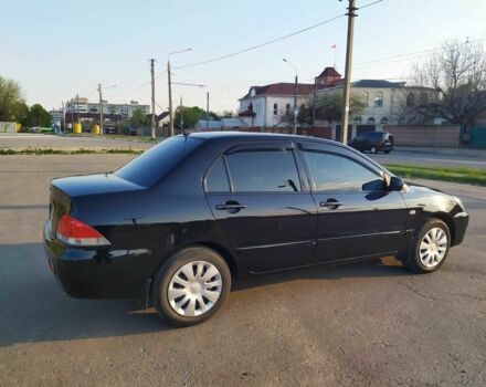 Черный Мицубиси Лансер, объемом двигателя 1.6 л и пробегом 32 тыс. км за 9000 $, фото 12 на Automoto.ua