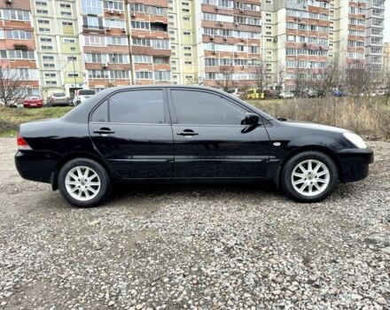 Чорний Міцубісі Lancer, об'ємом двигуна 1.6 л та пробігом 216 тис. км за 4990 $, фото 5 на Automoto.ua