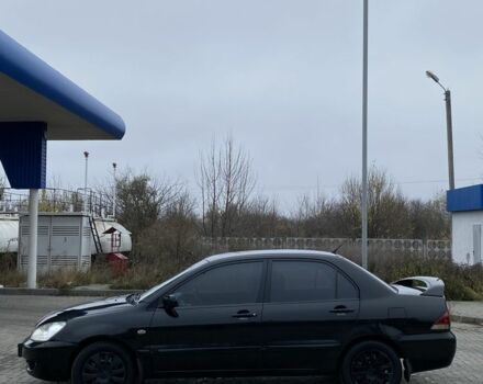 Черный Мицубиси Лансер, объемом двигателя 1.6 л и пробегом 263 тыс. км за 2900 $, фото 6 на Automoto.ua