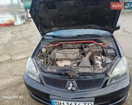 Черный Мицубиси Лансер, объемом двигателя 2 л и пробегом 286 тыс. км за 4000 $, фото 15 на Automoto.ua