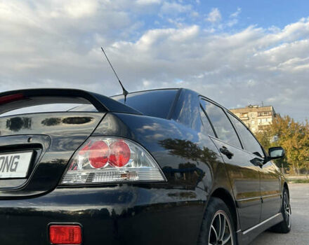 Чорний Міцубісі Lancer, об'ємом двигуна 2 л та пробігом 280 тис. км за 4600 $, фото 23 на Automoto.ua