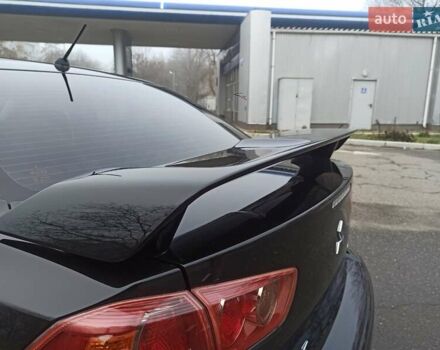 Черный Мицубиси Лансер, объемом двигателя 2 л и пробегом 195 тыс. км за 7899 $, фото 27 на Automoto.ua