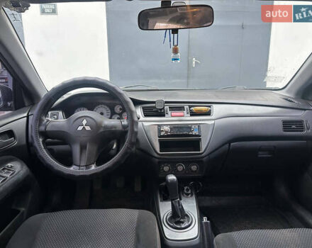 Черный Мицубиси Лансер, объемом двигателя 1.58 л и пробегом 290 тыс. км за 3000 $, фото 11 на Automoto.ua