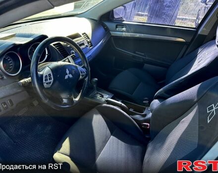 Черный Мицубиси Лансер, объемом двигателя 2 л и пробегом 250 тыс. км за 5900 $, фото 1 на Automoto.ua