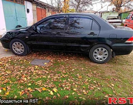 Чорний Міцубісі Lancer, об'ємом двигуна 1.6 л та пробігом 227 тис. км за 4100 $, фото 3 на Automoto.ua