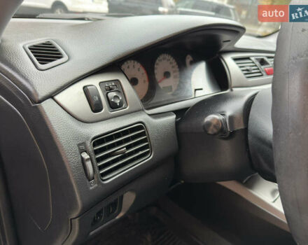 Чорний Міцубісі Lancer, об'ємом двигуна 1.58 л та пробігом 173 тис. км за 4700 $, фото 12 на Automoto.ua