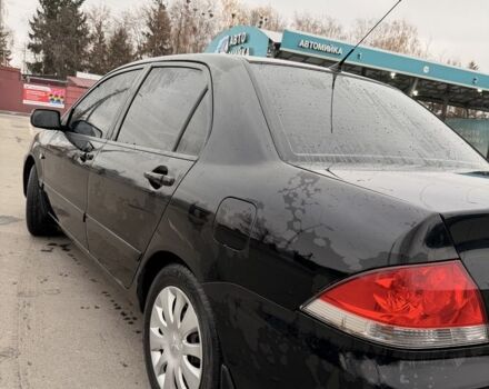 Черный Мицубиси Лансер, объемом двигателя 1.6 л и пробегом 240 тыс. км за 3500 $, фото 3 на Automoto.ua