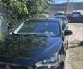 Черный Мицубиси Лансер, объемом двигателя 2 л и пробегом 258 тыс. км за 6107 $, фото 1 на Automoto.ua