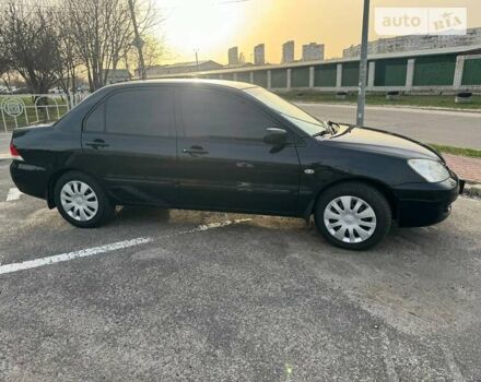 Чорний Міцубісі Lancer, об'ємом двигуна 1.58 л та пробігом 172 тис. км за 5500 $, фото 1 на Automoto.ua