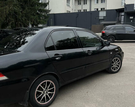 Чорний Міцубісі Lancer, об'ємом двигуна 1.58 л та пробігом 256 тис. км за 4200 $, фото 6 на Automoto.ua
