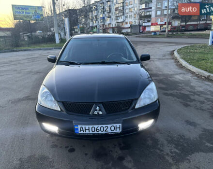 Черный Мицубиси Лансер, объемом двигателя 1.6 л и пробегом 315 тыс. км за 4000 $, фото 4 на Automoto.ua