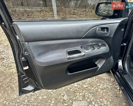 Черный Мицубиси Лансер, объемом двигателя 1.6 л и пробегом 216 тыс. км за 4990 $, фото 12 на Automoto.ua