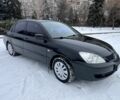 Чорний Міцубісі Lancer, об'ємом двигуна 1.6 л та пробігом 260 тис. км за 3999 $, фото 1 на Automoto.ua