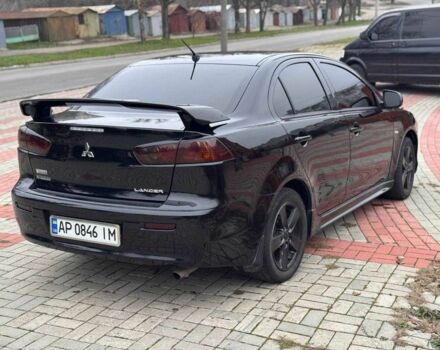 Черный Мицубиси Лансер, объемом двигателя 2 л и пробегом 217 тыс. км за 5500 $, фото 7 на Automoto.ua