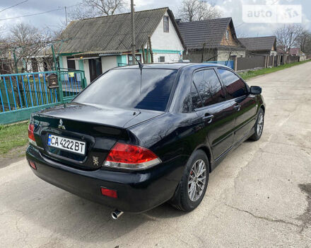 Чорний Міцубісі Lancer, об'ємом двигуна 1.6 л та пробігом 235 тис. км за 4900 $, фото 5 на Automoto.ua