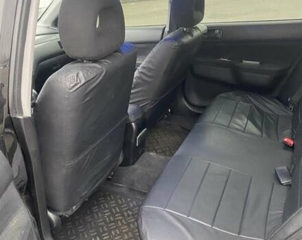 Черный Мицубиси Лансер, объемом двигателя 1.58 л и пробегом 263 тыс. км за 4000 $, фото 28 на Automoto.ua