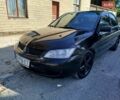 Чорний Міцубісі Lancer, об'ємом двигуна 1.58 л та пробігом 250 тис. км за 2900 $, фото 1 на Automoto.ua
