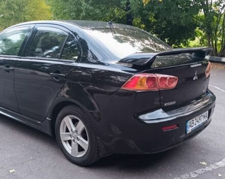 Черный Мицубиси Лансер, объемом двигателя 2 л и пробегом 210 тыс. км за 6000 $, фото 6 на Automoto.ua