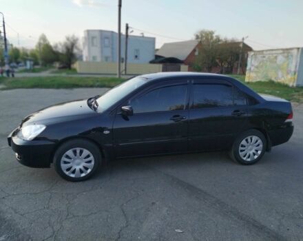 Черный Мицубиси Лансер, объемом двигателя 1.6 л и пробегом 32 тыс. км за 9000 $, фото 1 на Automoto.ua