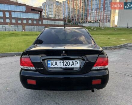 Черный Мицубиси Лансер, объемом двигателя 1.58 л и пробегом 237 тыс. км за 3999 $, фото 9 на Automoto.ua