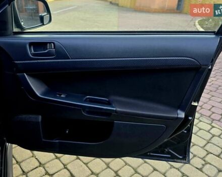 Черный Мицубиси Лансер, объемом двигателя 2 л и пробегом 260 тыс. км за 6555 $, фото 33 на Automoto.ua