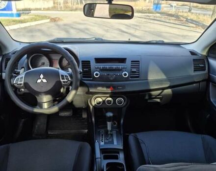 Черный Мицубиси Лансер, объемом двигателя 2 л и пробегом 224 тыс. км за 7000 $, фото 6 на Automoto.ua