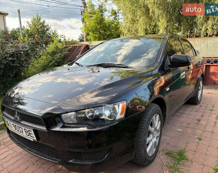 Черный Мицубиси Лансер, объемом двигателя 1.5 л и пробегом 111 тыс. км за 7500 $, фото 1 на Automoto.ua