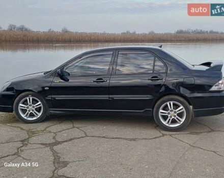 Черный Мицубиси Лансер, объемом двигателя 2 л и пробегом 286 тыс. км за 4000 $, фото 3 на Automoto.ua