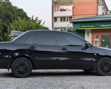 Черный Мицубиси Лансер, объемом двигателя 1.6 л и пробегом 226 тыс. км за 4800 $, фото 12 на Automoto.ua