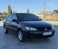 Чорний Міцубісі Lancer, об'ємом двигуна 1.6 л та пробігом 261 тис. км за 3665 $, фото 1 на Automoto.ua