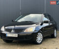 Чорний Міцубісі Lancer, об'ємом двигуна 1.58 л та пробігом 185 тис. км за 3750 $, фото 1 на Automoto.ua