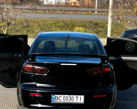 Черный Мицубиси Лансер, объемом двигателя 2 л и пробегом 333 тыс. км за 7300 $, фото 7 на Automoto.ua