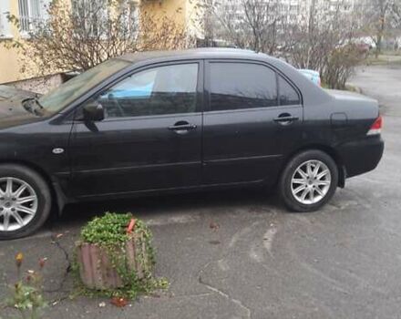 Черный Мицубиси Лансер, объемом двигателя 1.6 л и пробегом 215 тыс. км за 3900 $, фото 1 на Automoto.ua