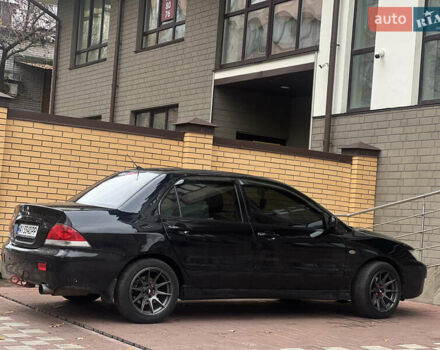 Черный Мицубиси Лансер, объемом двигателя 1.6 л и пробегом 211 тыс. км за 5700 $, фото 11 на Automoto.ua