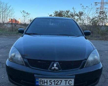 Черный Мицубиси Лансер, объемом двигателя 2 л и пробегом 280 тыс. км за 5400 $, фото 1 на Automoto.ua