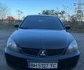 Черный Мицубиси Лансер, объемом двигателя 2 л и пробегом 280 тыс. км за 5400 $, фото 1 на Automoto.ua