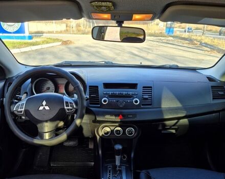 Черный Мицубиси Лансер, объемом двигателя 2 л и пробегом 224 тыс. км за 7000 $, фото 3 на Automoto.ua