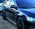 Чорний Міцубісі Lancer, об'ємом двигуна 2 л та пробігом 176 тис. км за 7500 $, фото 1 на Automoto.ua