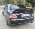 Міцубісі Lancer 2007 у Кам'янське (Дніпродзержинськ) на Automoto.ua Чорний Міцубісі Lancer, об'ємом двигуна 2 л та пробігом 268 тис. км за 5999 $, фото 3 на Automoto.ua