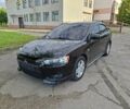 Черный Мицубиси Лансер, объемом двигателя 2 л и пробегом 173 тыс. км за 8100 $, фото 1 на Automoto.ua