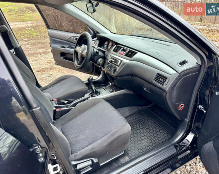 Черный Мицубиси Лансер, объемом двигателя 1.6 л и пробегом 216 тыс. км за 4990 $, фото 17 на Automoto.ua