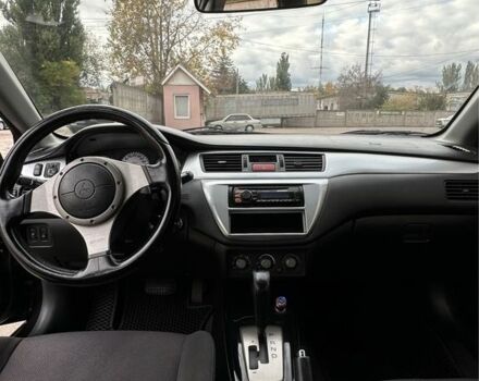 Чорний Міцубісі Lancer, об'ємом двигуна 2 л та пробігом 143 тис. км за 5400 $, фото 6 на Automoto.ua