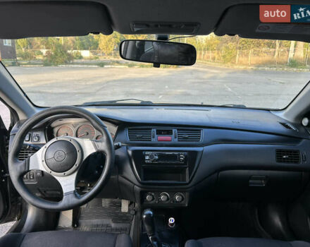 Чорний Міцубісі Lancer, об'ємом двигуна 2 л та пробігом 280 тис. км за 4600 $, фото 43 на Automoto.ua